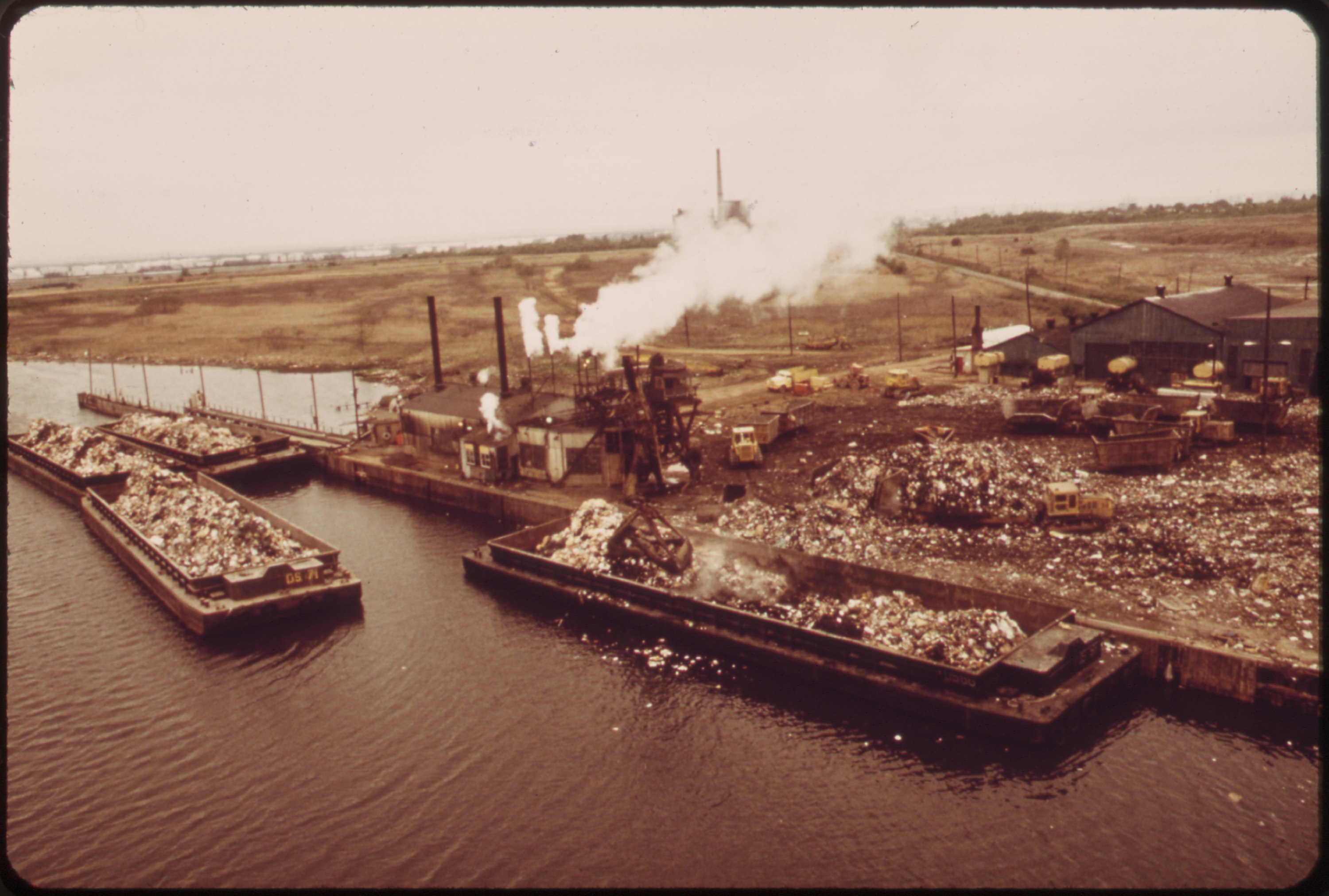 lossy-page1-3000px-GARBAGE_SCOWS_BRING_SOLID_WASTE,_FOR_USE_AS_LANDFILL,_TO_FRESH_KILLS_ON_STATEN_ISLAND,_JUST_EAST_OF_CARTERET,_NJ_-_NARA_-_548315.tif.jpg