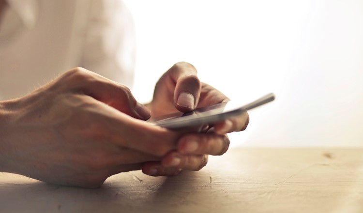 person-using-smartphone-1458283.jpg